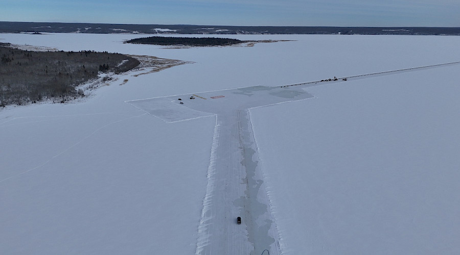 Aerial view of ice road and platform built on frozen lake for Frog Lake winter project