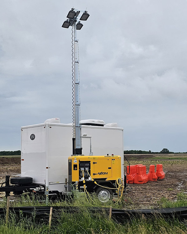 Axiom combination light tower and power units supporting temporary facilities on a Missouri data center construction project