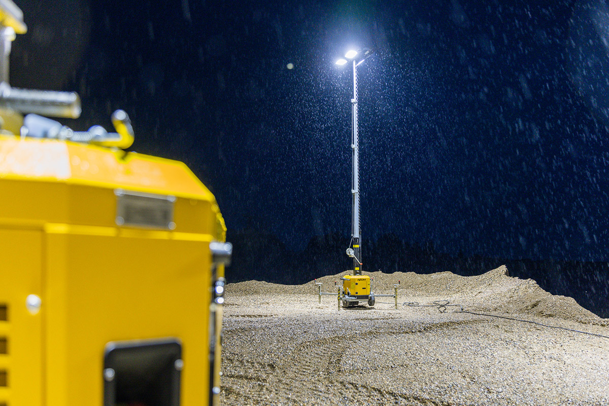 Axiom Hybrid and electric light tower on helping reduce fuel consumption on a construction site at night